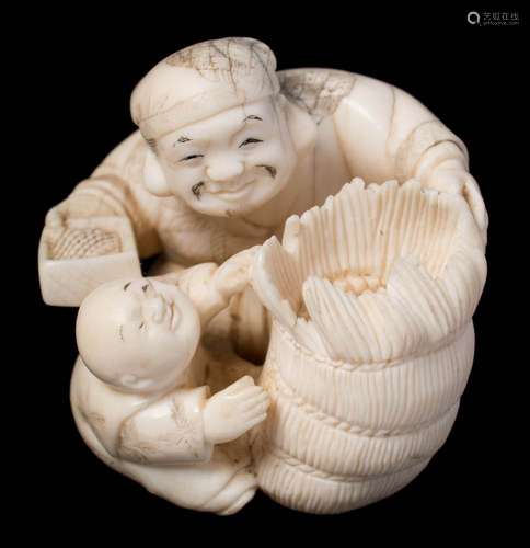 A Japanese carved ivory netsuke: depicting Daikoku with a bale of rice and a karako boy,