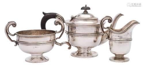 A George V silver three-piece tea service, maker's marks worn, Birmingham,