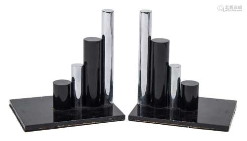 A pair of Modernist bronze and steel bookends: each with four stepped cylindrical rods to a painted