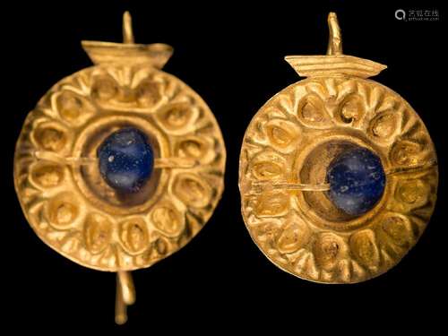 A pair of antique Roman gold and blue glass bead earrings: each with an embossed circular panel