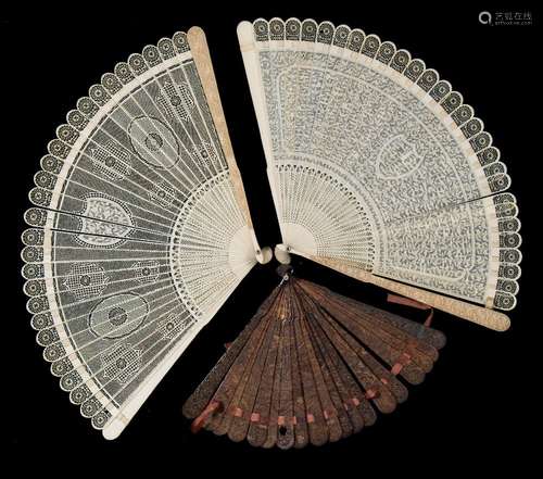 A 19th century carved ivory brise fan: carved to one side with shield shaped cartouche and foliate