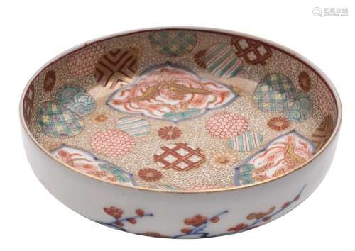 A small Fukugawa dish: the interior decorated with three Phoenix panels reserved on a profuse