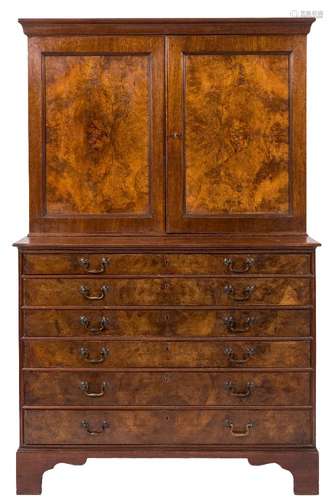 A 19th Century estate cabinet:, in walnut and figured walnut, the upper part with a moulded cornice,