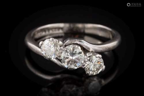 A diamond mounted three-stone crossover ring: with circular brilliant-cut diamonds approximately 0.