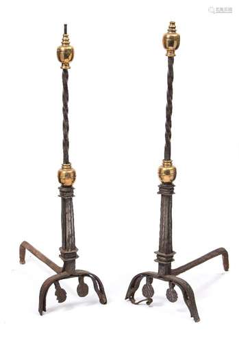 A pair late 17th/early 18th century andirons: the steel spiral twist stems surmounted by brass ball