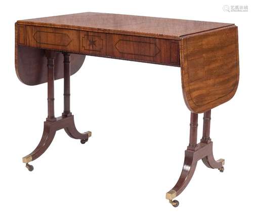 A Regency mahogany and inlaid sofa table:, bordered with lines, the hinged top with rounded corners,