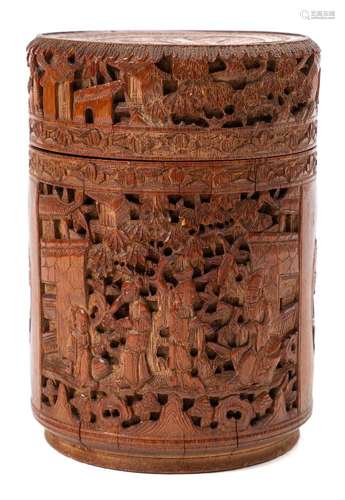 A Chinese carved bamboo cylindrical box and cover: carved overall with figures on terraces, phoenix,