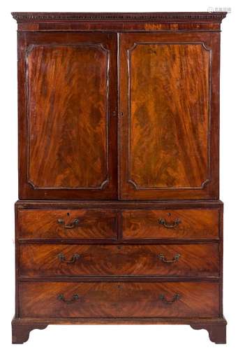 A George III mahogany linen press:, the upper part with a moulded dentil cornice,