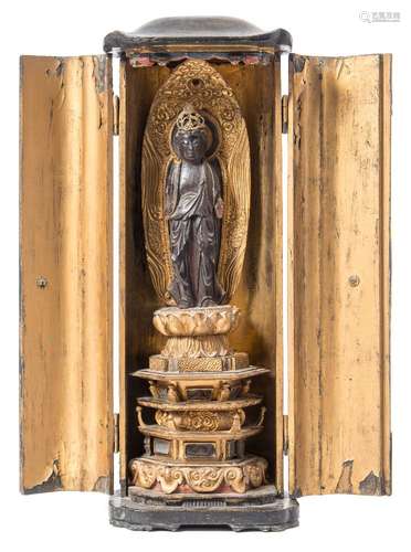 A 19th century Chinese carved gilt wood shrine figure: possibly Guan Yin,