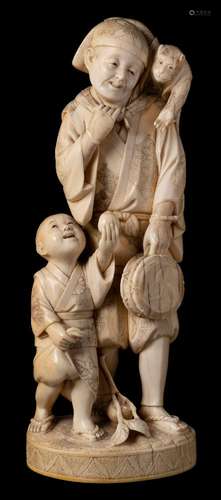 A Japanese carved ivory okimono of a peasant and boy: the man with a tethered monkey sitting on his