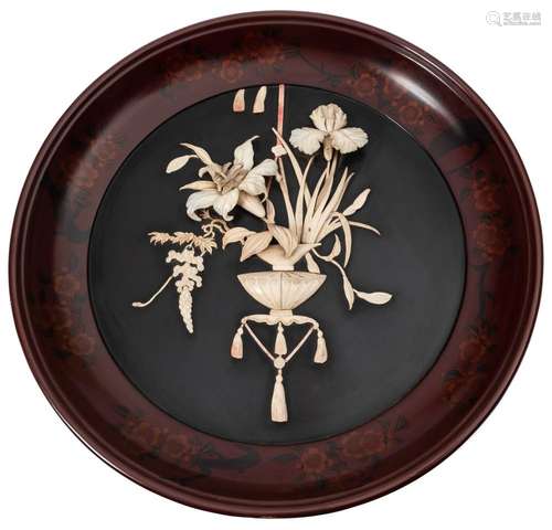 A Japanese lacquered and ivory panel: of circular outline,