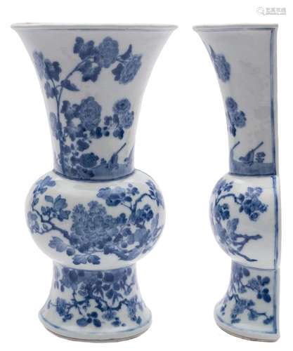 A Chinese blue and white wall vase: of rounded baluster half-section, painted with two birds, peony,