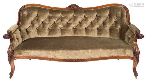 A Victorian carved rosewood settee:, upholstered in moss green dralon fabric,