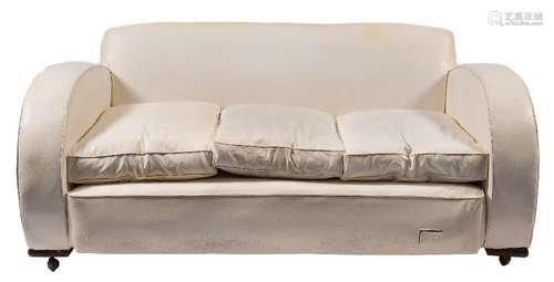 An Art Deco style three piece lounge suite:, upholstered in ivory coloured leather,