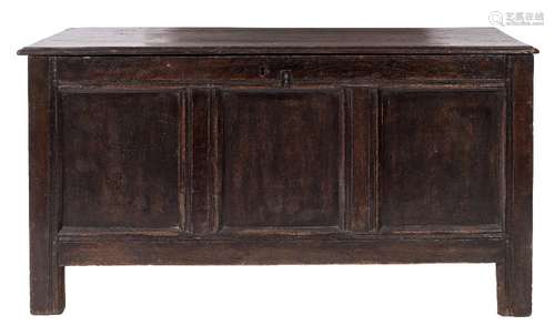 An 18th Century oak rectangular coffer:, with a hinged moulded top and triple moulded panel front,