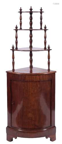 A 19th Century French mahogany bow-fronted standing corner cupboard:,