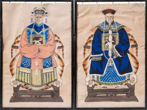 A pair of 19th century Chinese painted silk panels: each depicting a seated Emperor in traditional