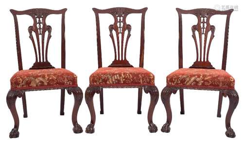 A set of eight carved mahogany dining chairs in the Chippendale taste:,