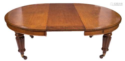 A Victorian oak oval extending dining table:,