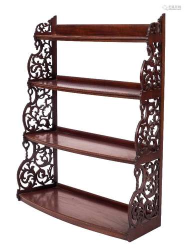 A mahogany four tier graduated bow-fronted hanging open bookcase:,