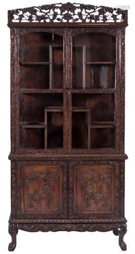 A 19th Century carved hardwood display cabinet:, possibly Goanese,