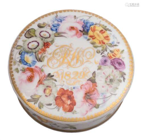 An early 19th century English porcelain circular box and cover: probably Coalport,