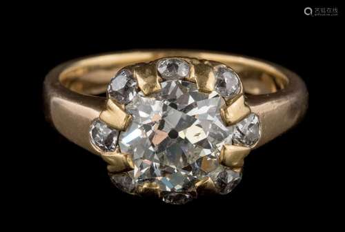 A late 19th century gold and diamond ring: the principal cushion-shaped old,