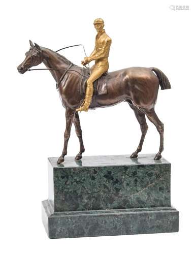 A mid 19th century bronze and gilt bronze group: the jockey in traditional racing attire mounted on