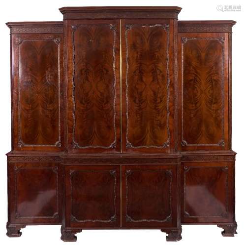 A carved mahogany breakfront library cabinet bookcase in the Chippendale taste:,