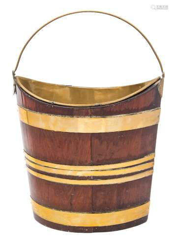 An 18th century mahogany and brass bound navette shaped bucket: of coopered construction,