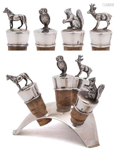 A set of four German silver novelty bottle stoppers: surmounted with a squirrel, horse,