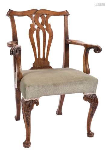 An 18th Century carved walnut and fruitwood elbow chair:, in the Chippendale taste,