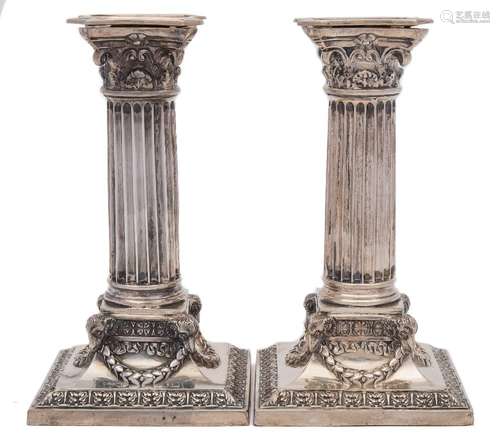 A pair of Victorian silver Corinthian column candlesticks, maker Martin, Hall & Co, London,