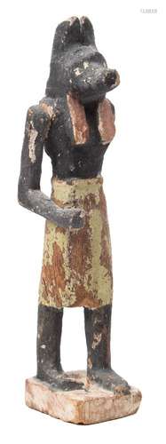 A carved and painted wood figure of Anubis: with one mobile arm (damaged) 6cm.