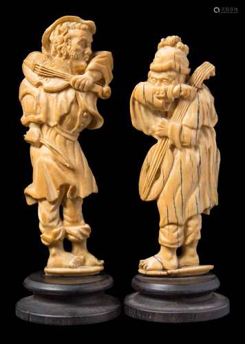 A pair of late 19th century Dieppe carved ivory figures: peasant musicians,