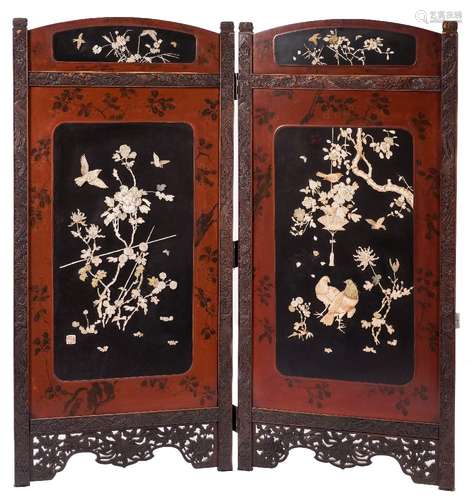 A Japanese carved wood and red and black lacquer two fold screen:,