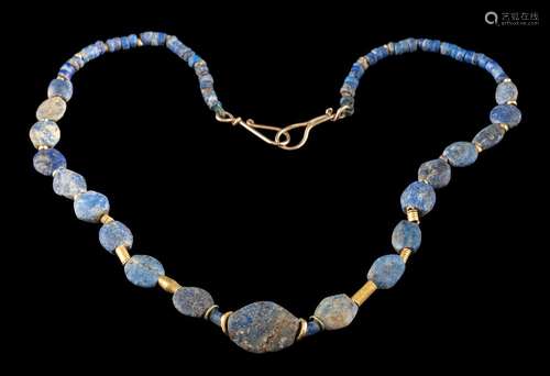 A lapis lazuli and gold bead mounted necklace: with Bactrian lapis lazuli beads and modern fittings.