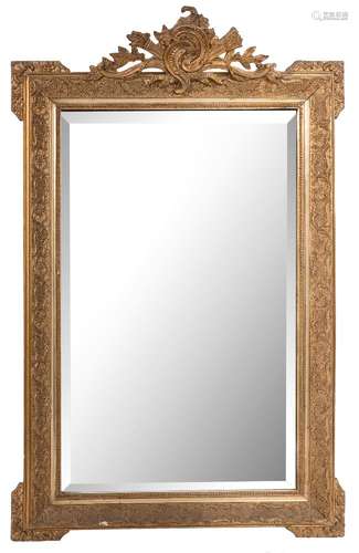 A giltwood and gesso rectangular pier mirror:, with cresting in the form of a flaming torch,