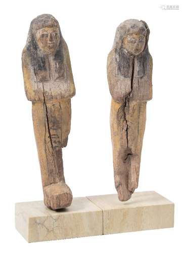 A wooden polychrome ushabti of mummiform: with traces of hieroglyphs on a later stand together with