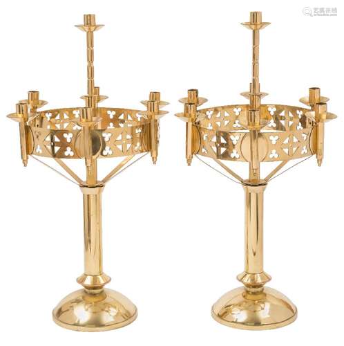 A pair of Arts and Crafts Gothic revival candelabra: the plain central column with single nozzle