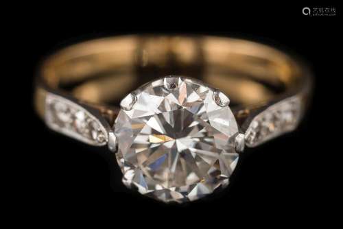 A diamond single-stone ring: the round brilliant-cut diamond approximately 8.