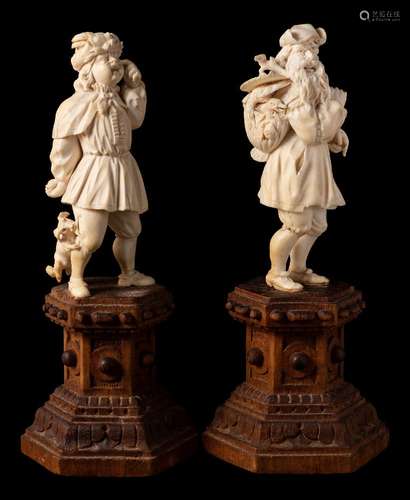 A 19th century German carved ivory figure : of a bearded peasant in traditional ragged clothes