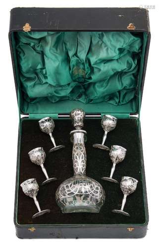 A Continental clear glass and silver mounted liqueur set: includes decanter and stopper together