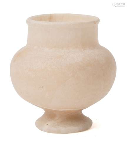 An Egyptian white alabaster pedestal goblet: with collared rim 9cm high.