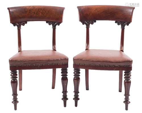 A set of twelve early Victorian mahogany dining chairs: the backs with broad curved bar top rails