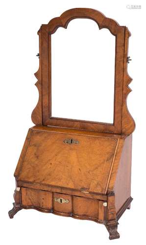 A walnut and inlaid swing frame toilet mirror in the early 18th Century taste:,