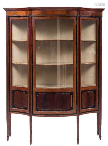 An Edwardian mahogany, ebonised banded and inlaid serpentine fronted display cabinet:,