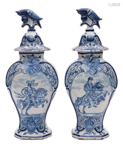 A pair of Dutch blue and white delftware vases and covers: of octagonal baluster form,