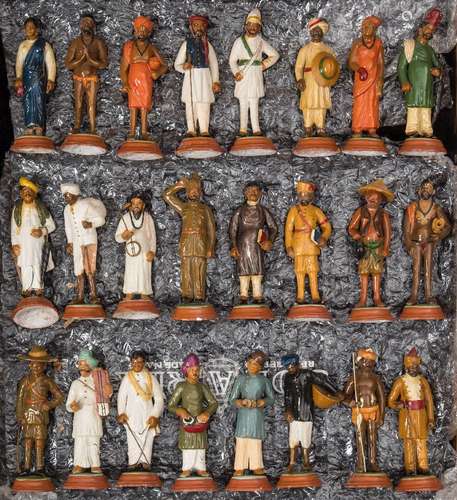 A collection of twenty four Indian Raj plaster and terracotta educational figures: depicting