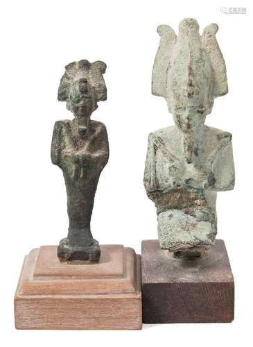 A small bronze figure of Osiris: in standing mummiform pose on a wooden stand;